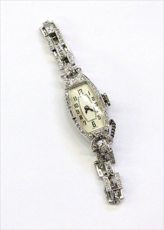 CROTON diamond platinum wristwatch: Diamond CROTON wristwatch; of platinum and 18k white gold, having (125) diamonds weighing approximately 1.25 cts, 17 jewel movement. Total watch weight 19.3 grams