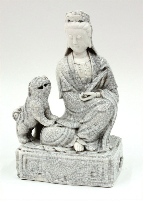 Chinese White Ware Bodhisattva, Qing/Republic: Chinese unusual Dehua porcelain figure, late Qing/Republic, fashioned as a bodhisattva seated in royal ease holding a ruyi scepter, accompanied by a lively fu-lion resting its front paws on his knee a