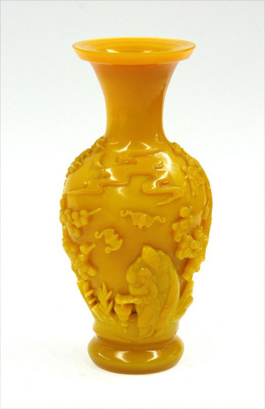 Chinese Yellow Peking Glass Vase: Chinese yellow Peking glass vase, the ovoid body decorated in high relief with a drunken sage and attendant walking in a landscape with majestic pines wreathed with clouds, a pair of bats and solitary