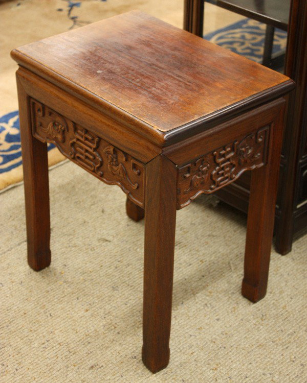 Chinese Hardwood Stand/Small Table: Chinese carved hardwood stand/small table, with a single rectangular plank set above a beaded shape apron carved with a shou character in relief bracketed by a pair of bats, rising from straight beade
