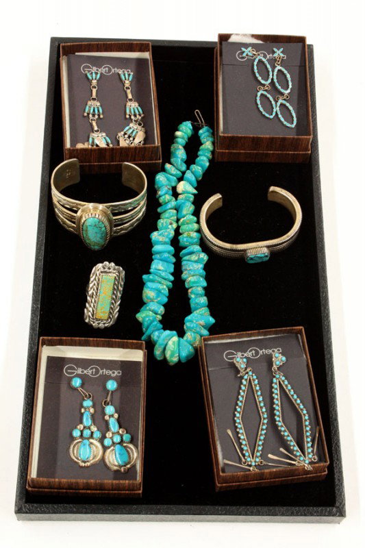 Native American Jewelry: (lot of 12) Native American jewelry items, including; a turquoise nugget bead necklace, two sterling cuff bracelets with central turquoise stone, a sterling and turquoise ring, together with four pair