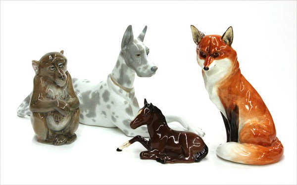 Porcelain animal figurines: (lot of 4) Porcelain animal figurines consisting of a Lladro Great Dane, 6.75''h x 12''l; Royal Worcester fox, 7.25''h; Royal Copenhagen monkey, 5''; and a Royal Doulton horse, 3''h x 4.75'' (slight c