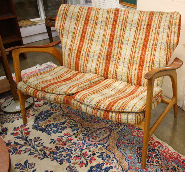 Finn Juhl style upholstered settee: Finn Juhl style upholstered settee, circa 1960, with orange and yellow fabric, raised on a mahogany and oak frame, 32''h x 48''w x 28''d