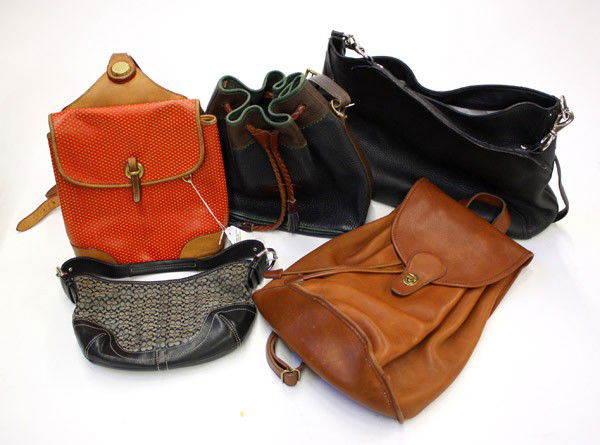 Group of purses: (lot of 5) Purses, including; Dooney Bourke red backpack, Dooney Bourke drawstring shoulder bag, Coach logo bag and a Coach large leather backpack, largest: 18''h x 12''w x 6''d