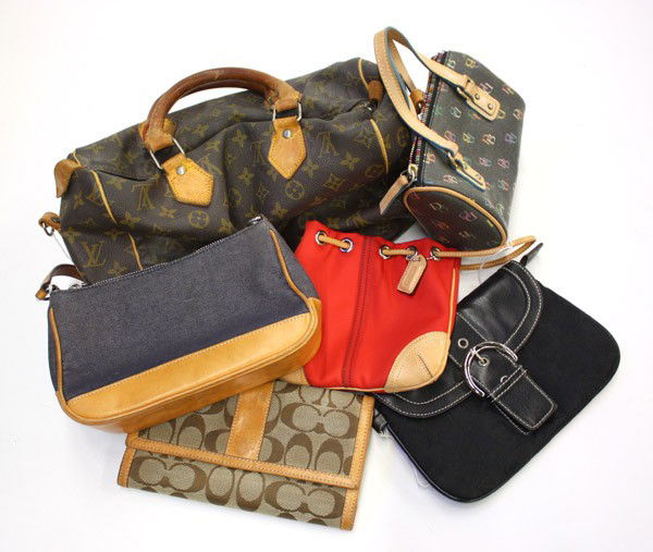 Group of purses: (lot of 6) Purses, including;Louis Vuitton speedy purse, Coach purse, red Coach drawstring purse, Coach clutch purse, Coach logo wallet, and a Dooney Bourke heart purse, largest: 11''h x 12''w x 7''d