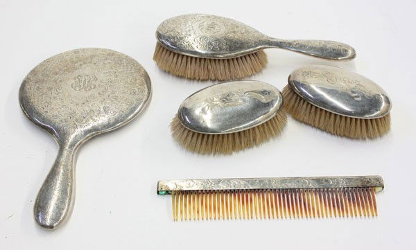 Sterling dresser set: Five piece sterling silver dresser set consisting of three brushes, hand mirror, and a tortoise shell comb