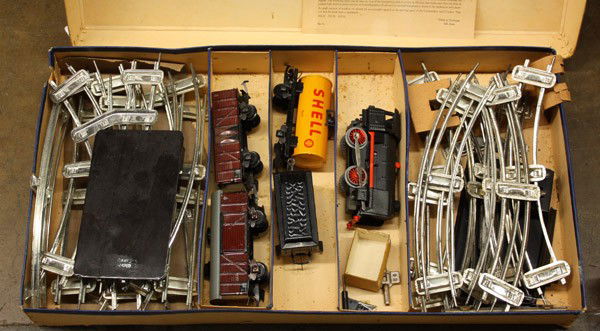 wind up train set: Tin Wind-up Train Set, circa late 1940s, Karl Bub, US Zone, Germany, ''S'' gauge, includes tin wind-up locomotive engine w/ coal tender, 'Shell' tank car, 'high side' gondola/hopper, box car, left and