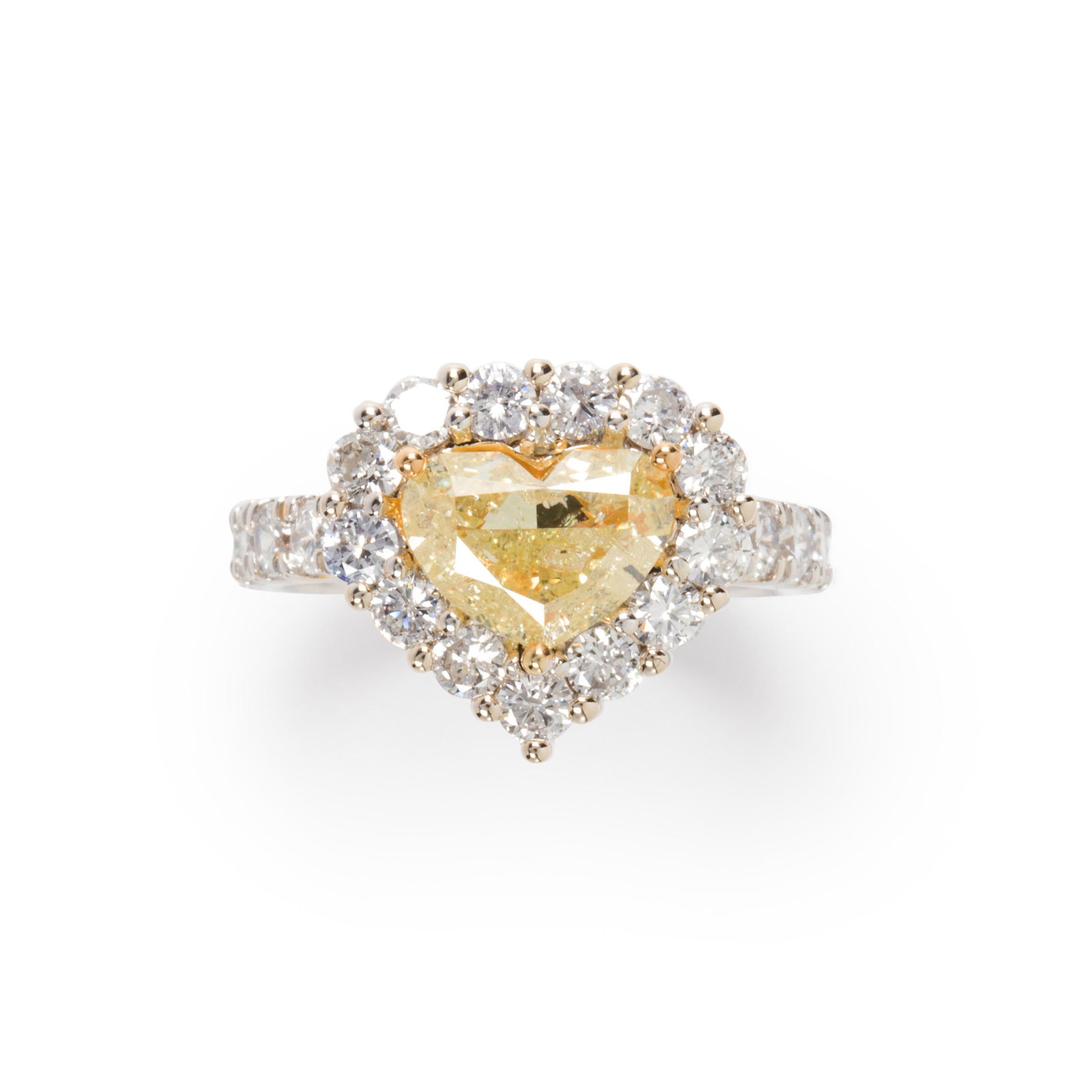 A yellow diamond, diamond and eighteen karat white gold: A yellow diamond, diamond and eighteen karat white gold ring designed as a heart-cut yellow diamond, weighing approximately 2.00 carats, framed by round brilliant-cut diamonds; estimated total remaini