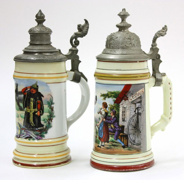 German beer steins with a lithophane base: (lot of 2) German beer steins, circa 1910, with lithophane bases, one depicting two ladies and the second stein a fraulein drinking wine, the exterior of one stein is decorated with two monks, the oth