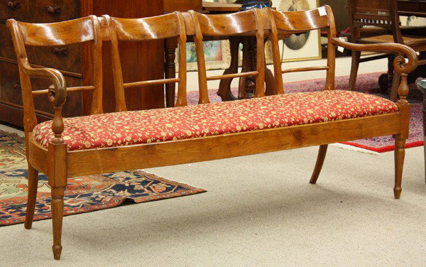 Italian provincial cherry settee: Italian Provincial settee circa 1830, having a shaped and carved crestrail above the four section back, the outswept arms terminating in stylized swans neck returns and rising on turned and tapered le