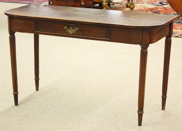 American federal style oak console table: American federal style oak console table circa 1880, with a rectangular surface, the front edge with radius corners, above a conforming apron, with a single drawer, with brass batwing hardware and a b