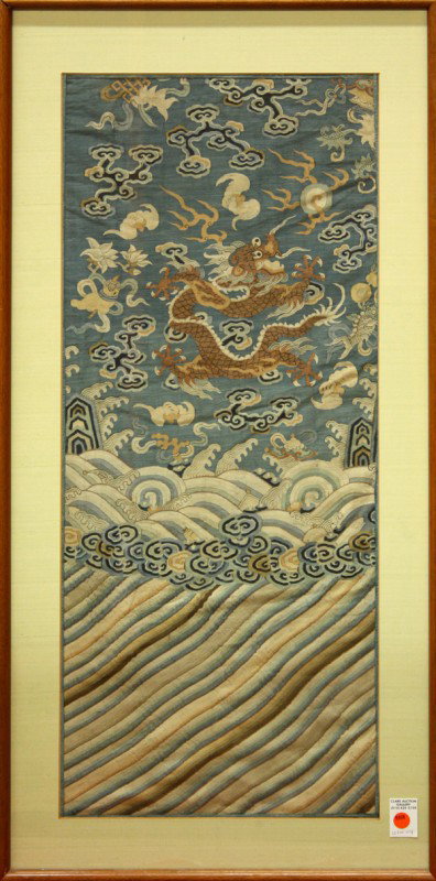 Chinese Kesi Panel, Dragon Robe, Qing: Framed Chinese kesi court robe fragment, centered by a meandering gilt dragon amid cloud scrolls, bats and other auspicious emblems on a blue ground set above cresting waves and a lishui border, all e