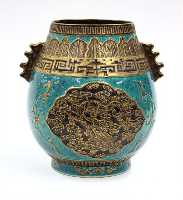 Chinese Trompe l'Oeil Porcelain Jar: Chineset trompe-l'oeil gilt and robin's egg blue glazed jar, of pear shape with simulated gilt metal flange-like handles issuing from a stiff-leaf and fretwork band above two large shaped panels of dr