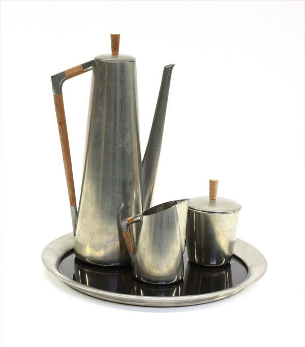 Mid-Century coffee service: Mid-century Danish pewter and teak coffee service by Royal Holland consisting of a coffee pot, lidded sugar, and creamer, together with an associated round pewter and composite tray by Stieff, largest