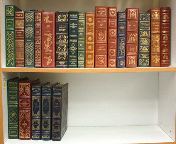 Twenty one leatherbound classic books: (lot of 21) Two shelves of leatherbound books, including the International Collectors Library and the Franklin Mint, with various classic titles including ''The Arabian Nights'', ''War and Peace'', ''