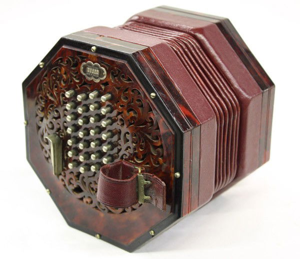Wheatstone Concertina: Concertina, Wheatstone, London, England, with fretted hexagonal endplates, with six-fold maroon leather bellows, with fifty-six English system buttons, 7''h x 5''w