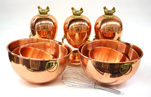 Copper kitchen articles: (lot of 10)Group of associated copper kitchen articles including three Tagus, Portugal copper and brass egg coddlers 9''h, six graduated mixing bowls, and a whisk