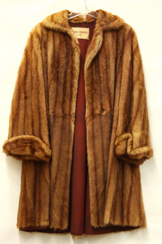 Two fur coats: (lot of 2) Chinese mink coat, by George Benioff Furs, professionaly cleaned and stored; together with a faux cheetah fur coat with a J. Percy for Marvin Richards label, professionally cleaned and stor