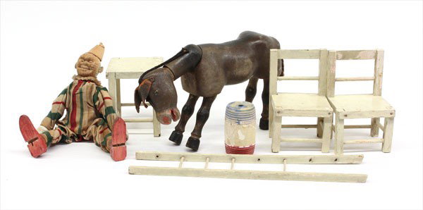 American folk art wood clown & mule: (lot of 7) American folk art wood clown and mule, with associated wood furniture, circa 1920, the clown has a jointed body constructed from clothes pegs, and dressed in flower sack cotton, the polychr