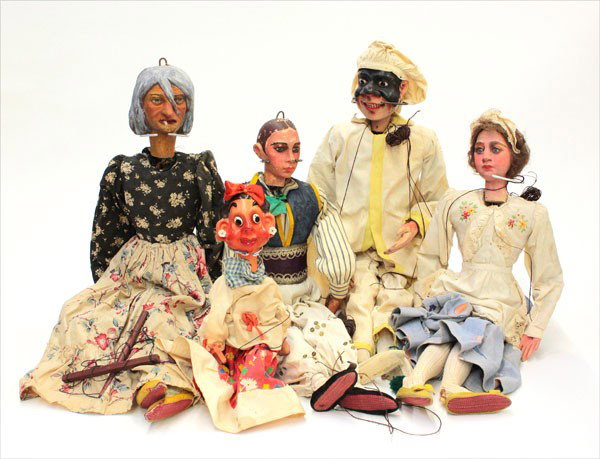 Italian theatre puppets: (lot of 5) Group of nineteenth century folk art Italian theatrical puppets, each having a polychrome decorated carved wood head and papier mache hands with naturalistic features and clothed in period 