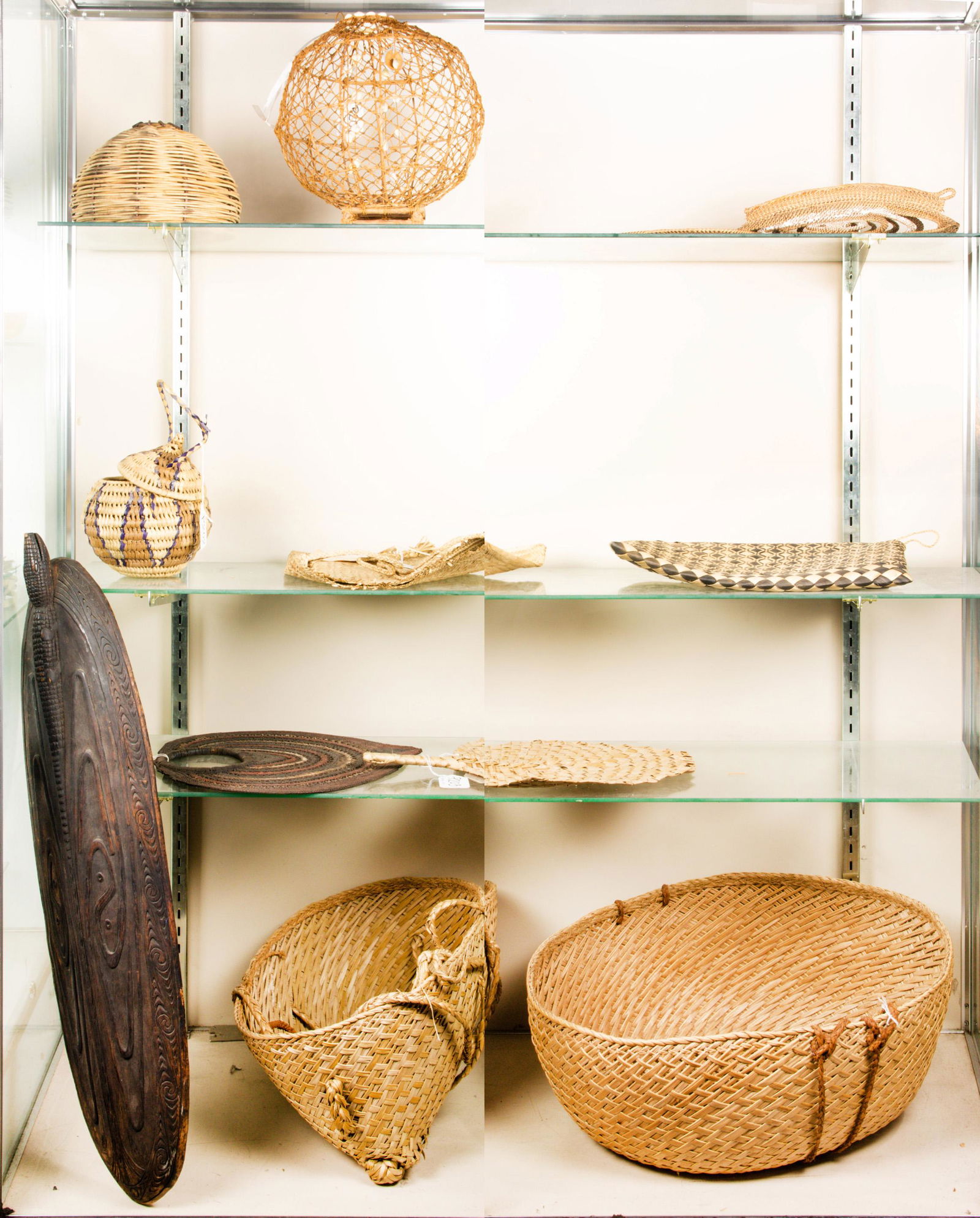 Four shelves of ethnographic art (1 of 1)