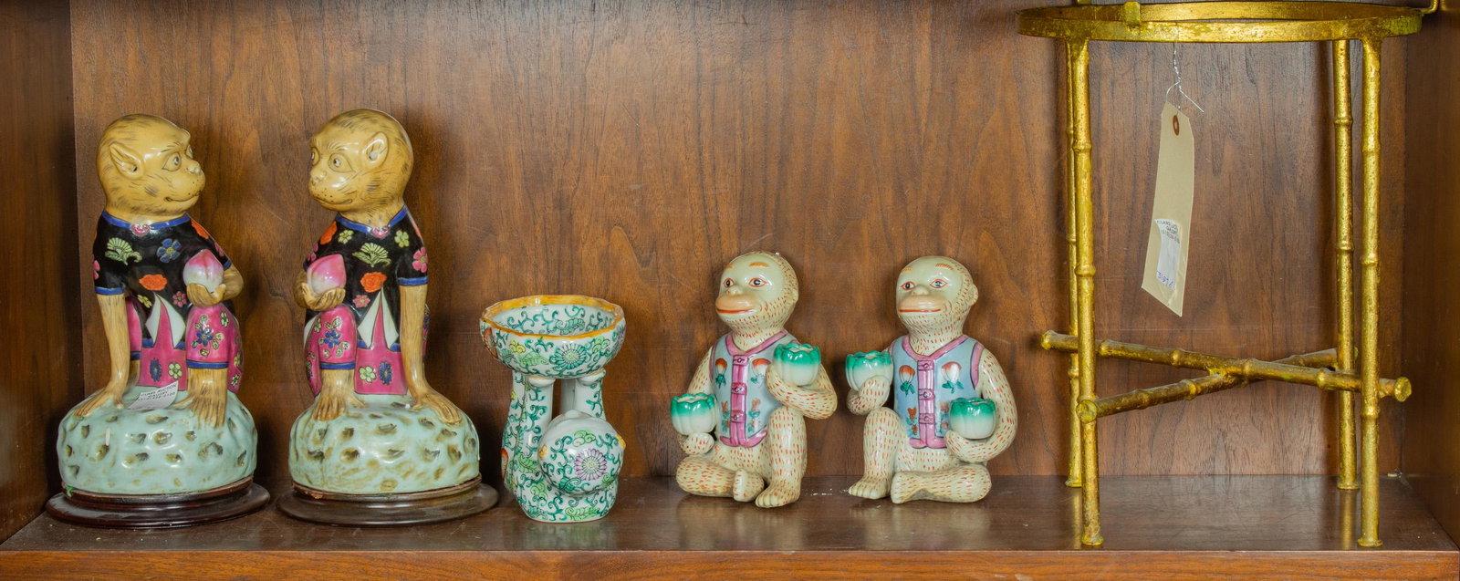 (Lot of 6) Chinese Export pairs of monkeys holding: (Lot of 6) Chinese Export earthenware figures of monkeys, including two pairs of monkeys holding fruit, one pair mounted on hardwood stands, the fifth, a recumbent monkey holding up a bowl, the larges
