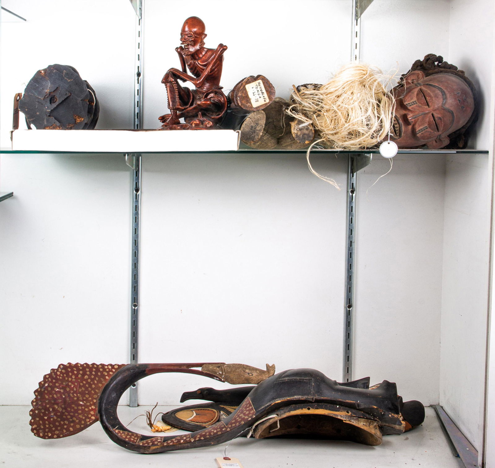 Two shelves of Oceanic art including a carved wood (1 of 1)