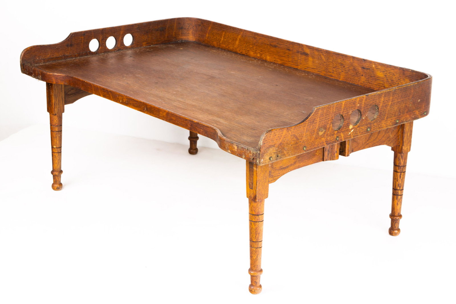 Late Victorian lap tray: Late Victorian lap tray, executed in oak, and rising on turned legs, 10"h x 23"w x 15"d