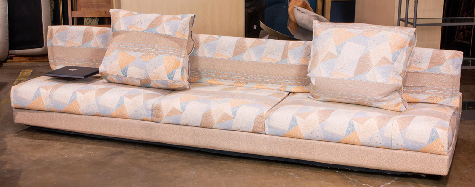 (lot of 2) Saporiti Italia modular sofa suite: (lot of 2) Saporiti Italia modular sofa suite, one having an adjustable central back separating two seating areas, 29"h x 119"w x 38"d, the other with a crescent form lacquered table form back, 25"h x