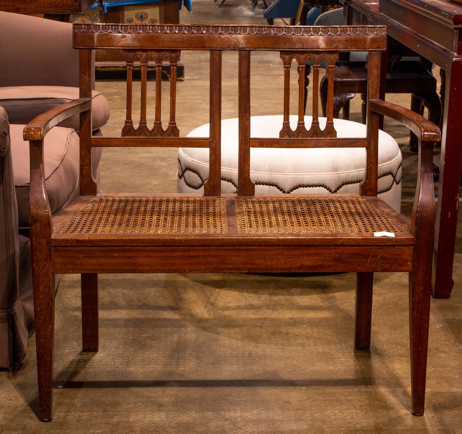 A Louis Phillipe style settee: A Louis Phillipe style settee, having a cane seat, 33"h x 35"w x 16"d