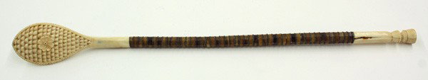 Ivory and baleen: Ivory and Baleen back scratcher, circa 1875, the carved mount having a rosette medallion within a teardrop form, 15.25'' x 1.5''
