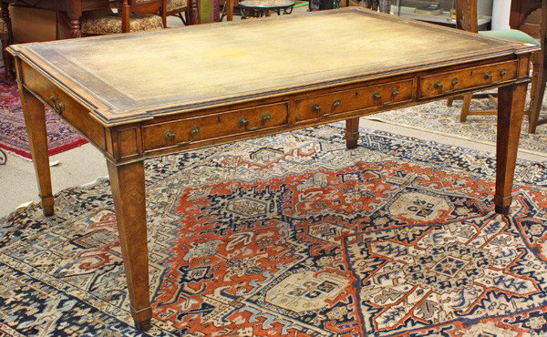 Neoclassical style partners desk: Neoclassical style partners desk circa 1890, the original embossed leather writing surface above a six drawer case executed in burl veneer, and rising on squared and tapered legs 30''h x 72''w x 48''d