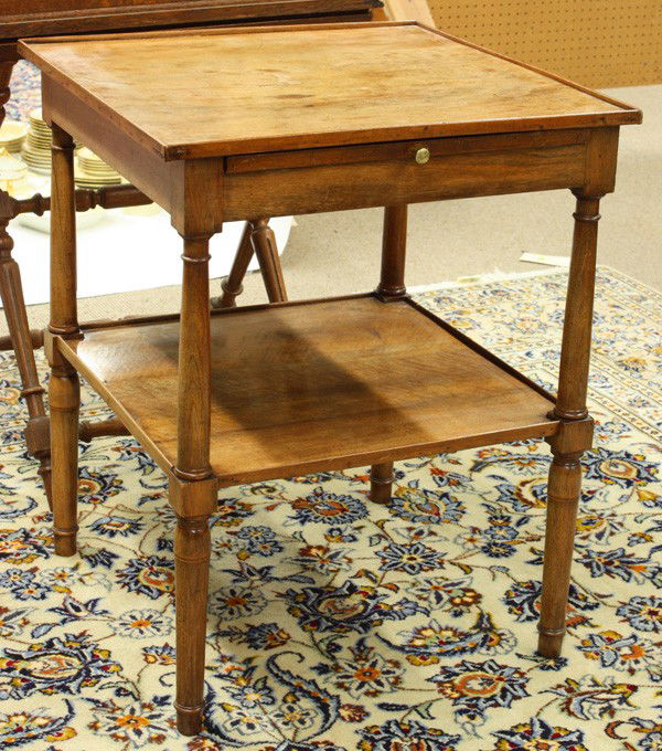 Continental Provincial style tea table: Continental Provincial style fruitwood tea table, having a square top above the single slide out tray, and rising on turned legs conjoined by the lower tier, 28''h x 23''square