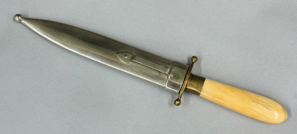 American Dirk knife, walrus ivory grip: American Dirk knife, circa 1870, with a 6.75'' spear point, one piece walurs ivory grip, with a brass ferule and pommel plate, German silver scabbard, overall: 11''