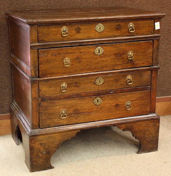 Charles II chest: Charles II chest, executed in oak, in two parts, each section with two graduated drawers with later pulls and rising on bracket feet, 37.5''h x 36''w x 23''d