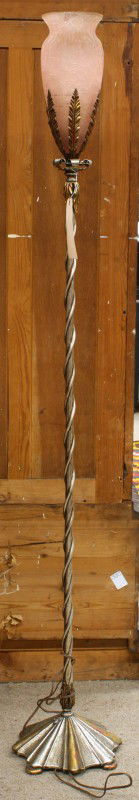 Art Deco floor lamp: Art Deco floor lamp, having a frosted amphora shaped shade and rising on a patinated metal base terminating on a scalloped base, 69''h