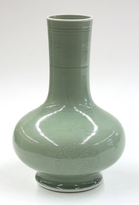 Chinese Celadon Glazed Porcelain Vase: Chinese celadon glaze decorated porcelain stick-neck vase, featuring four zoomorphic roundels to the compressed globular body below auspicious bats alternating with cloud scrolls repeated on the cylin