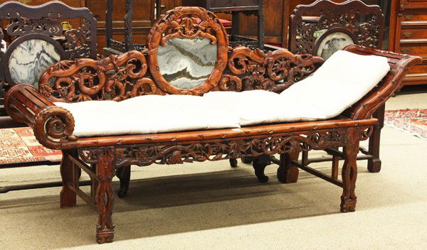 Chinese Hardwood Chaise with Marble Inlay: Chinese hardwood chaise, the back splat carved and reticulated with birds perched upon flowering gnarled branches bracketing a mottled gray marble plaque set within a faux bamboo frame, the rectangula