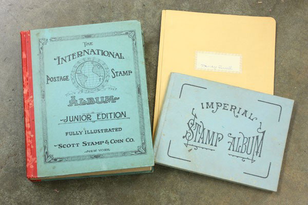 Group of stamp books: (lot of 3) stamp books, including ''The International Postage Stamp Album Junior Edition'', published 1933, ''The Imperial Stamp Album'', and an apparently homemade stamp scrapbook, all with numerous 