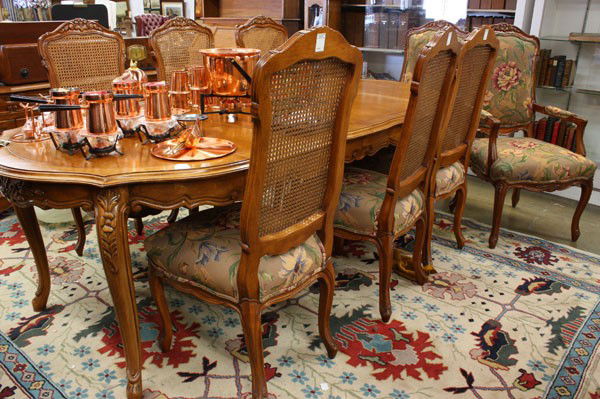 French Provincial style dining suite: (Lot of 11) French Provincial style dining suite, consisting of a table, having two leaves with a scalloped top and rising on cabriole legs 30''h x 91''l x 44''d, a sideboard 30''h x 65''w x 18''d, si