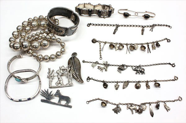 Jewelry Mexican Navajo bracelet pin necklace earri: Collection of silver jewelry, some Mexican and Navajo; including nine bracelets (five of the bracelets include charms), four pins/brooches, three money clips, one beaded necklace and a pair of earring