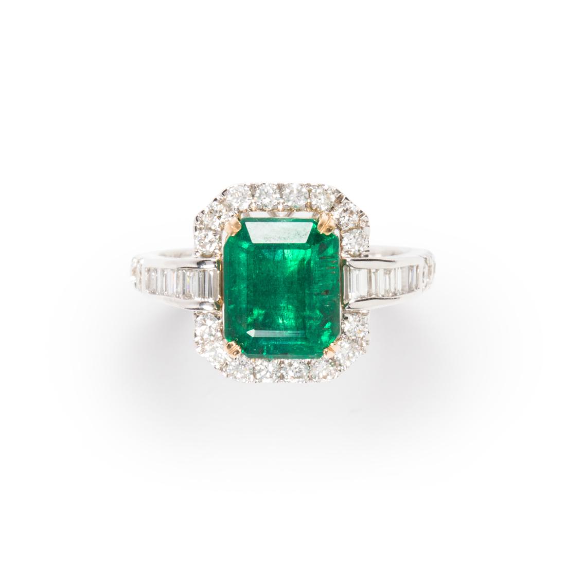 An emerald, diamond and fourteen karat white gold ring (1 of 3)
