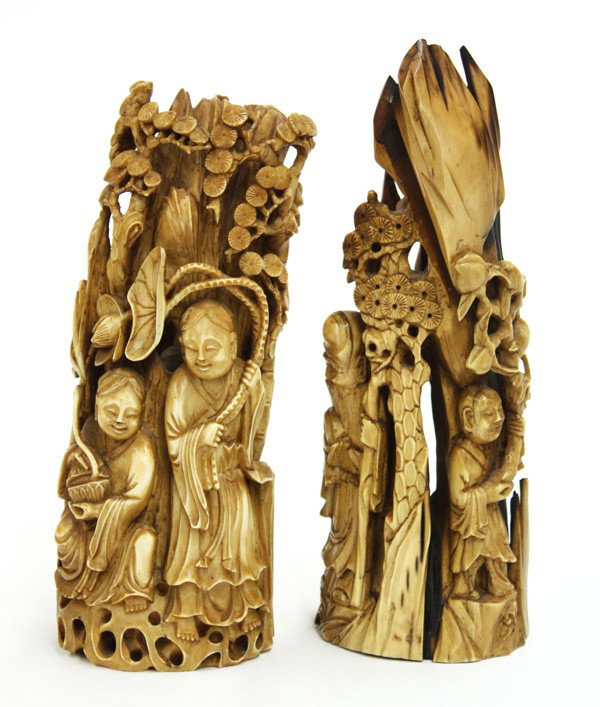 Chinese Ivory Figural Groups: (lot of 2) Chinese tinted ivory figural group, 20th century, the naturally contoured section of the tusk fashioned with a pair of celestials (possibly Hehe erxian) with one holding a lotus sprig while