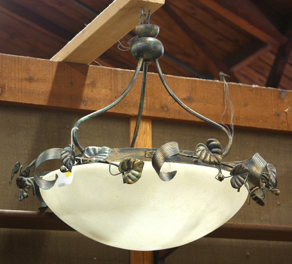 Patinated metal light fixture: Patinated metal light fixture, the frosted shade surmounted woth a leaf and vine motif suspended by the three arm supports, 23''h x 22''w