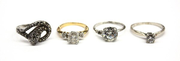 Collection of four rings: Collection of four rings; one of the rings is set with (1) solitaire diamond weighing 0.50 ct in 14k gold. Total weight of the four rings is 9.9 grams