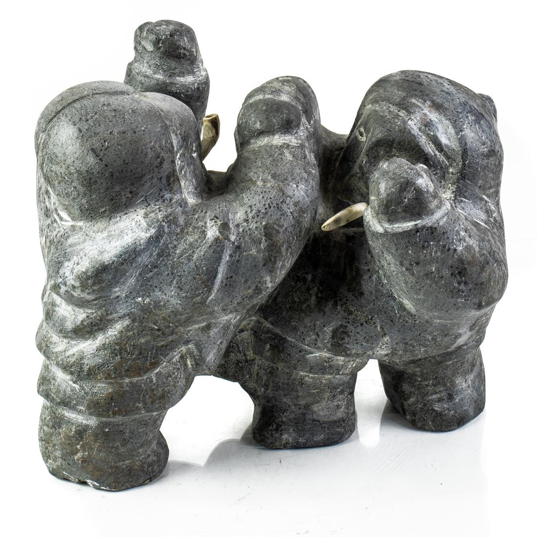 An Inuit basalt group of two eskimos smoking (1 of 3)