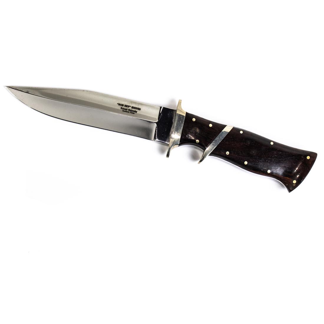 A "Bob Sky" double edged knife by Robert Hajovsky, Scotland, Texas: A "Bob Sky" double edged knife by Robert Hajovsky, Scotland, Texas, a hardwood handle with decorative silver nail bosses, a nickel silver guard and sub-hilt, 5.5" blade, overall 8"l.