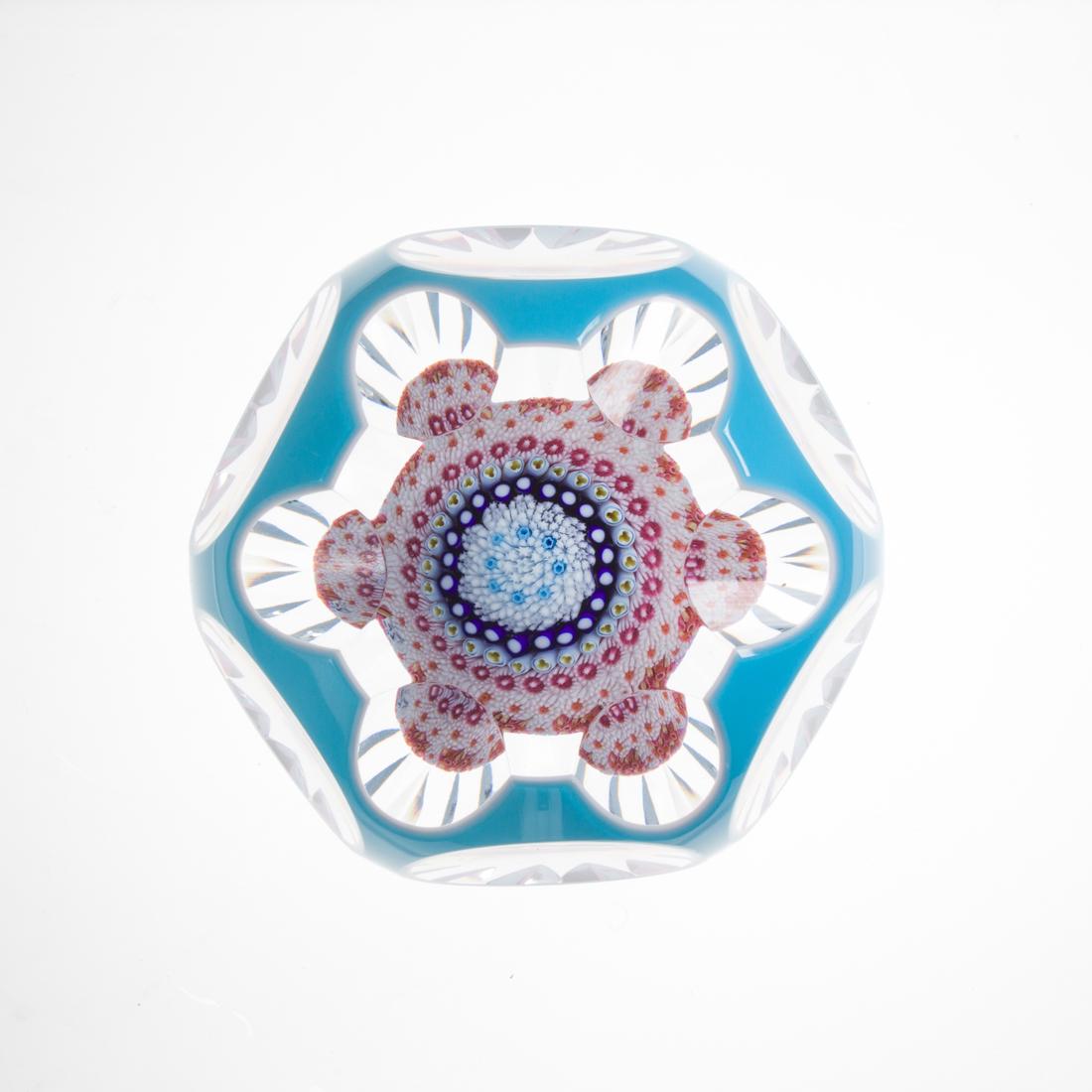 A Baccarat millefiore mushroom glass paperweight: A Baccarat millefiore mushroom glass paperweight, dated 1970, blue and white cased and faceted, date cane, numbered 54 of a limited edition, acid etched Baccarat mark, 2.25"h x 3"dia.