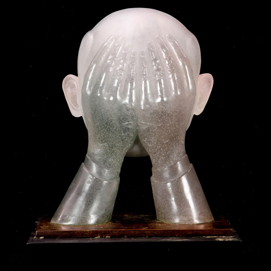 A Daum pate de verre glass and patinated bronze sculpture of Les Mains Sales: A Daum pate de verre glass and patinated bronze sculpture of Les Mains Sales (The Dirty Hands) designed by Roland Topor, limited edition 153 of 250, engraved 'Daum France, 153 / 250', incised 'R Topor