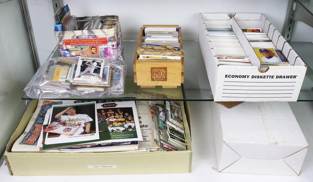 Two shelves of baseball cards, ticket stubs, magazine and newspapers (1 of 1)